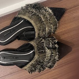 Black slides gold fringe